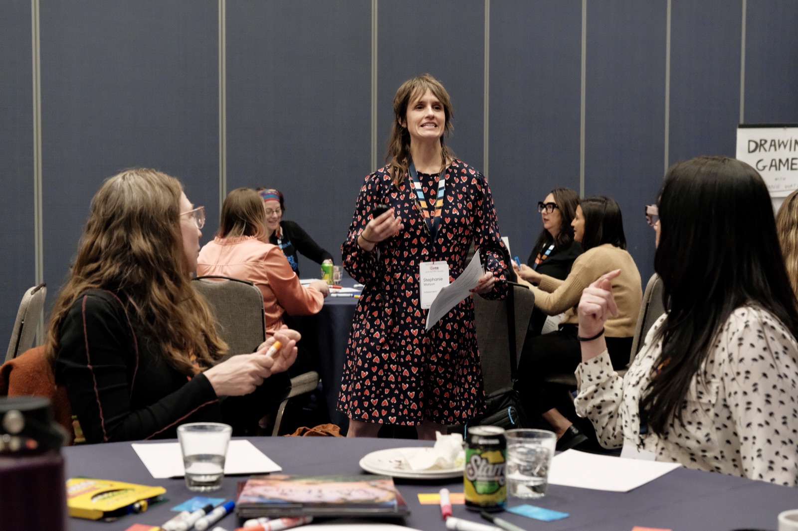 Stephanie Watson leads a group of conference attendees in playful drawing exercises.